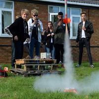 Students watching rockets take off